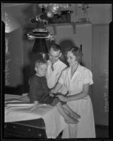 E. L. Scott and Grace Havey taking X-rays of Wilford Price, Los Angeles, 1935