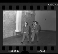 G. Gordon Liddy, in handcuffs, being escorted to Los Angeles Criminal Courts building, 1973