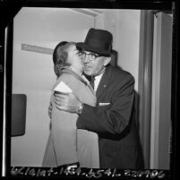 Los Angeles Police Chief William H. Parker getting a kiss from his wife Helen, 1964