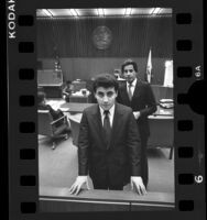 Sociz "Johnny" Junatanov and lawyer Joel Isaacson in court, Los Angeles, Calif., 1986