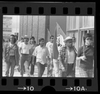 Cesar Chavez on march from Mexican border to Sacramento with United Farm Workers members in Redondo Beach, Calif., 1975