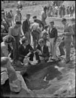 People gather at a location similar to the spot of the death of Melvin Hoffman, Los Angeles, 1936