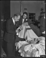 Judge Charles Fricke and Deputy D. A. George Stahlman look at evidence during the Nellie Madison murder trial, Los Angeles, 1934