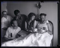 Aviator Pete Reinhart eating a meal with his wife after flying for 247 hours straight, Los Angeles, 1929