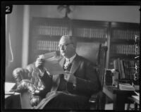 Asa Keyes, district attorney of Los Angeles County, reads a letter in his office, Los Angeles, 1923-1928
