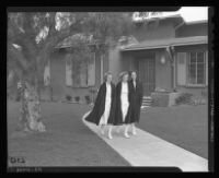 Ensigns Mavis Behrens, Helen Rhoades and Dorothy Olson leave nurses quarters at the Naval Hospital Long Beach to report for duty, Long Beach, 1943