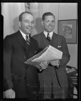 A. Felix Du Pont, Jr., conducts business with the help of C. J. Manning, Los Angeles, 1935