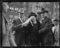 Murder suspect Madalynne Obenchain escorted to out of courthouse Los Angeles, ca. 1921