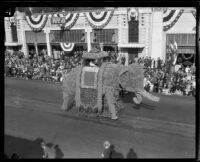 "Elephant" float with a prince and princess in a howdah in the Tournament of Roses Parade, Pasadena, 1926