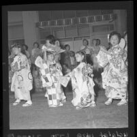 Japanese girls taking part in traditional Ondo dancing during Nisei Week festivities, Los Angeles, 1961