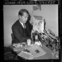 William Longstreth, chairman of the UCLA Victory in Vietnam Assn., displaying pro-Red literature, 1965