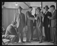 Sheriffs searching spectators at the courthouse during the Hickman kidnap and murder trial, Los Angeles, 1928