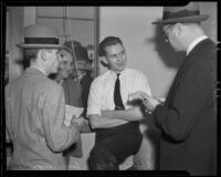 Elton Lady talking to officers and reporters after robbery, Los Angeles, 1936