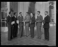 William G. Dickinson, Fred B. Palmer, H. Gordon Moore, B. W. Tye, John A. Ash, and Edward J. Partridge are presented with awards in real estate by Norman Chandler, Los Angeles, 1936