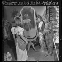 Three children modeling Halloween costumes made for Pasadena Assistance League's Craft Fair, Calif., 1964