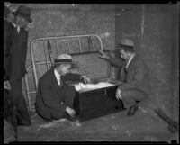 Unidentified detectives search the room where Rose Marie Happel was murdered, Los Angeles, 1934