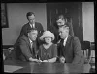 Peggy Caffee, witness to the murder of Alberta Meadows, with District Attorney William C. Doran and detective Dwight Longuevan, Los Angeles, 1922