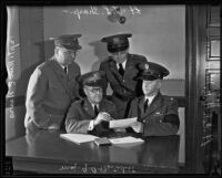 Lt. T.L. Sharp, Captain William E. Nevis, Major G.A. Benedict, and Lt. Col. H.H. Morehead assemble, Los Angeles, 1935