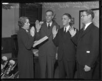 Mame Beatty of the Board of Supervisors administering the oath of office to Herbert C. Legg, John Anson Ford, Gordon L. McDonough, in the Hall of Records, Los Angeles, 1934