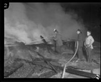 Firemen at the burning Hope Development School for mentally disabled girls in Playa del Rey, Los Angeles, 1924