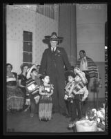 Harry Chandler greeting from Olvera Street children, Los Angeles, 1938