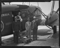 Julian K. Lyles, Grace Richardson, Hugh L. Smith, and Ralph S. Damon land after a sleeper flight at the Grand Central Terminal, Glendale, 1934