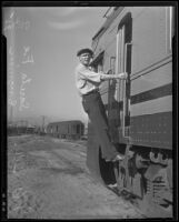 J.A. Burke, assistant chief engineer rides on the new Santa Fe Diesel train during a test run from Chicago to Los Angeles, Los Angeles, 1935