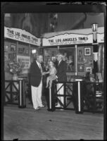 Waldo T. Tupper, Uncle John, and a child at the Los Angeles Times booth during the Eighth Annual National Radio Show, Los Angeles, 1930