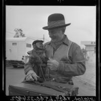 Organ grinder and monkey in Los Angeles, Calif., 1964