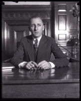 Buron Fitts seated in a courtroom, Los Angeles, 1920s — Calisphere