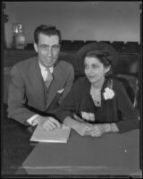 Attorney Theodore Rosenthal and his new bride Evelyn Rosenthal in a courtroom, Los Angeles, 1935