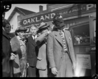 Stunt driver Hayward Thompson getting his blindfold checked, Los Angeles, 1927