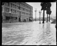 Rain-flooded commercial district at 6th and Kenmore, Los Angeles, 1927