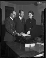 Norris G. Stensland, Eric Pedley, and Bess Bailey investigate extortion letter, Los Angeles, 1933