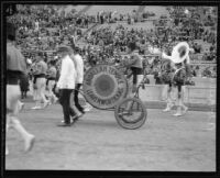 Bass drummer and Abdallah Temple marching band, Shriners' parade, Los Angeles Coliseum, Los Angeles, 1925