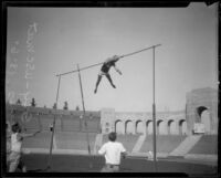 Lee Barnes of U.S.C. sets a new American record in the pole vault during the A.A.U. Relays, Los Angeles, 1926