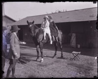 Two women sitting on a horse at the Ventura County Fair, Ventura County, 1924