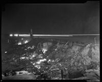 Charred remains of Castle Rock beach cabins, Los Angeles, 1938