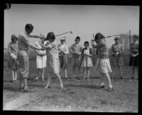 Girls with their golf instructor at the Wilshire Country Club, Los Angeles, 1927