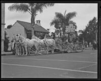 Horse-drawn float in the Old Spanish Days Fiesta parade on State Street, Santa Barbara, 1935