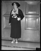 Mrs. J. L. Criswell smiling and standing outside of Assembly Hall, Los Angeles, 1935