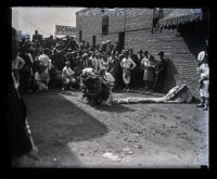 Dragon Dance puppet with spectators and Chinese performers, Los Angeles, 1929