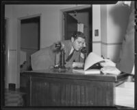 Max Factor using the telephone after his wife's car accident, Los Angeles, 1936