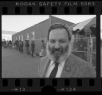 Los Angeles' Single Room Occupancy Housing Corp. director Andy Raubeson wearing button that reads "House the Homeless", 1985