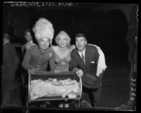 Spike Jones, Marilyn Monroe and Ken Murray posing for camera at eighth annual Los Angeles Times charity football game, 1952