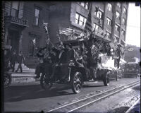 People riding in a Boos Bros Cafeteria car on Armistice Day, Los Angeles, 1918