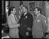 Chief James E. Davis greets Mexican Consul Ricardo G. Hill and his brother Benjamin Hill, Jr., Los Angeles, 1935