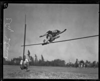 Elizabeth Stine, track athlete, engaged in high jump, circa 1922-1926