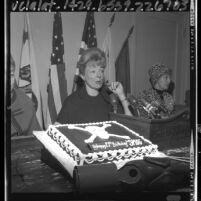 Afton Slade, president of Stamp Out Smog, at press conference marking smog's 21st anniversary, Los Angeles, Calif., 1964