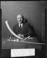 Anton Kolinowski with several ivory souvenirs from Africa, Los Angeles, 1932